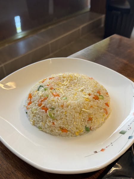 Fluffy egg fried rice served on a white square plate
