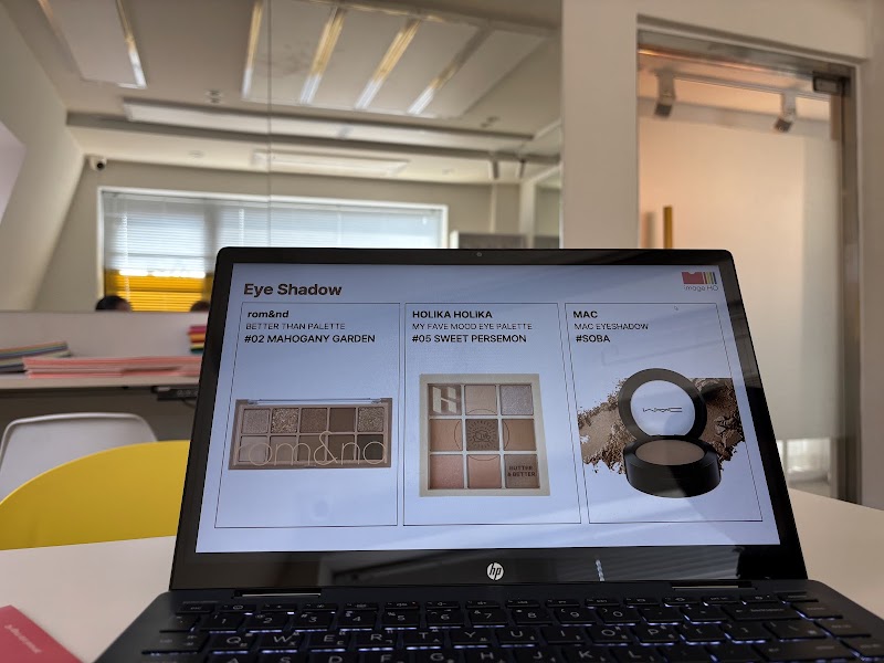 Laptop screen displaying eyeshadow palettes during a personal color consultation at Image HO
