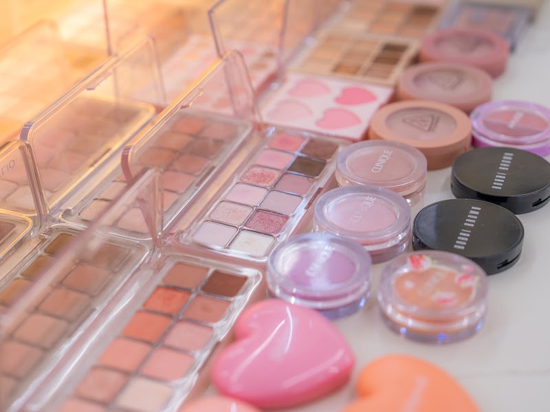 Selection of blush compacts and eye makeup shades used in consultations