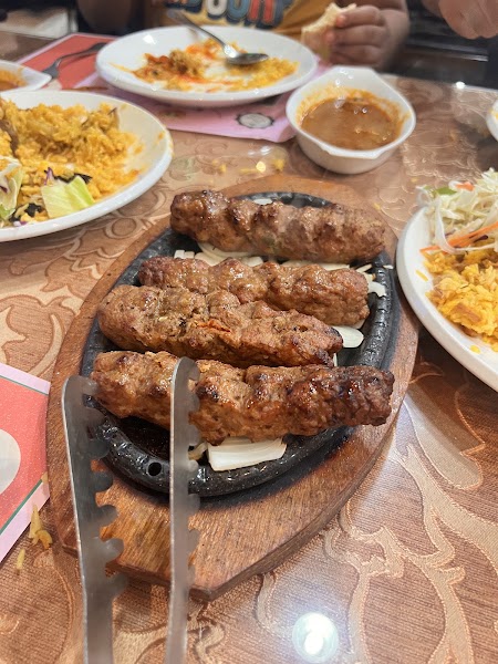 Sizzling seekh kebabs on a platter