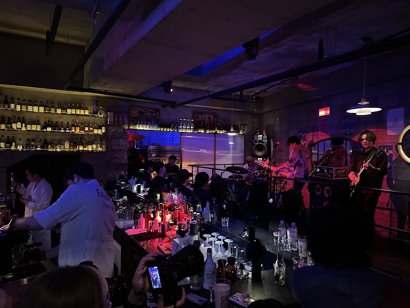 Live music and DJ performance in the atmospheric dimly lit bar setting at Fabrik Seoul