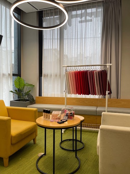 Fabric swatches on rack with cosmetics and consultation tools at color_al:Lim