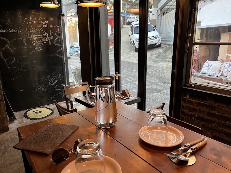 Table setting looking out of the wine bar window onto a quiet Itaewon street