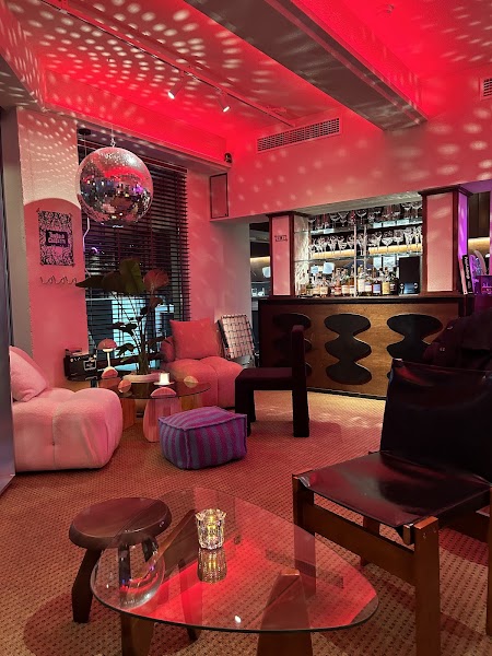 Interior lounge view with mood lighting and cozy corner seating at Tangled Cassette