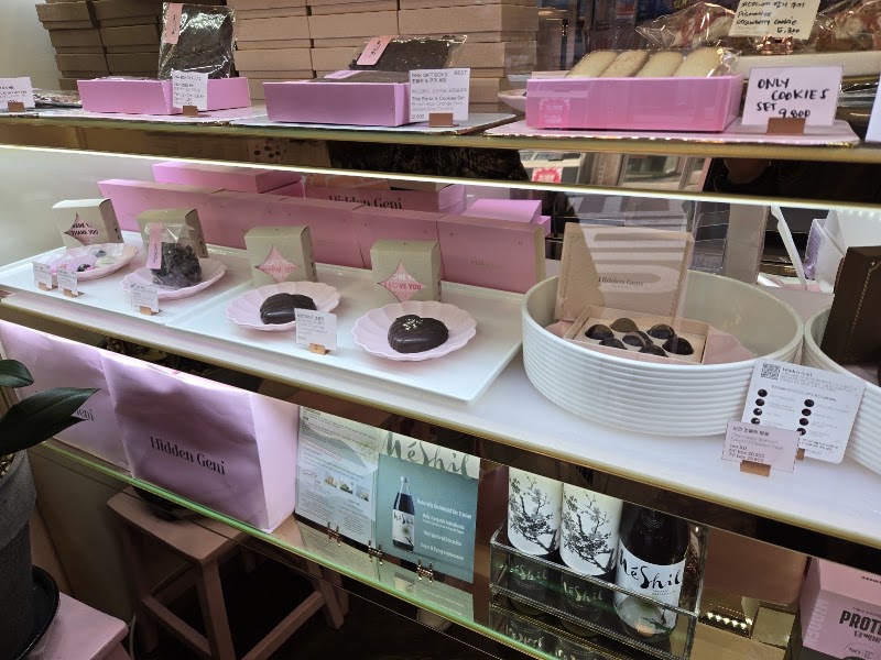 Glass display case at Hidden Gem featuring handcrafted confections