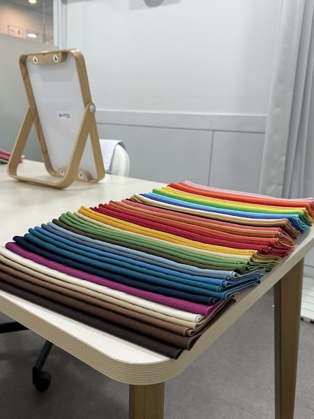 Arranged stacks of fabric swatches on consultation table