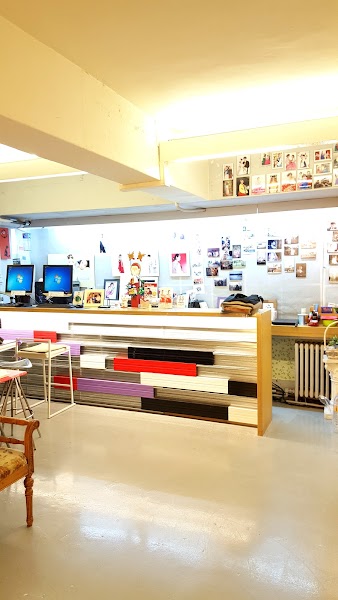 Reception counter with colorful accents at It's Me Photo Studio in Seoul.