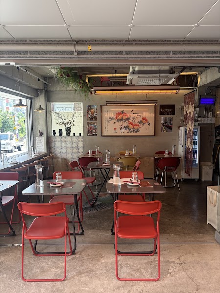 Daylight interior seating area featuring artwork and industrial finishes