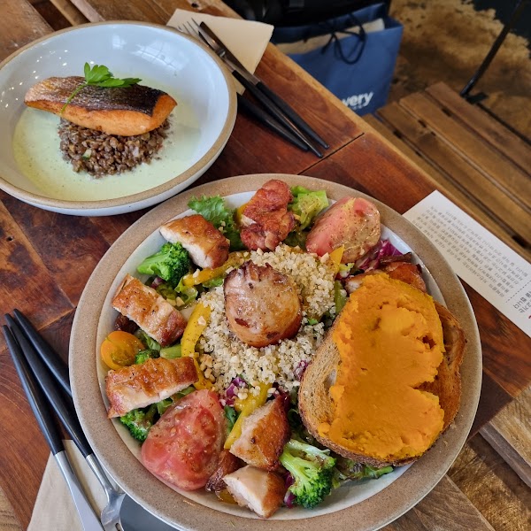 Two brunch dishes served on plates at La FERME restaurant.
