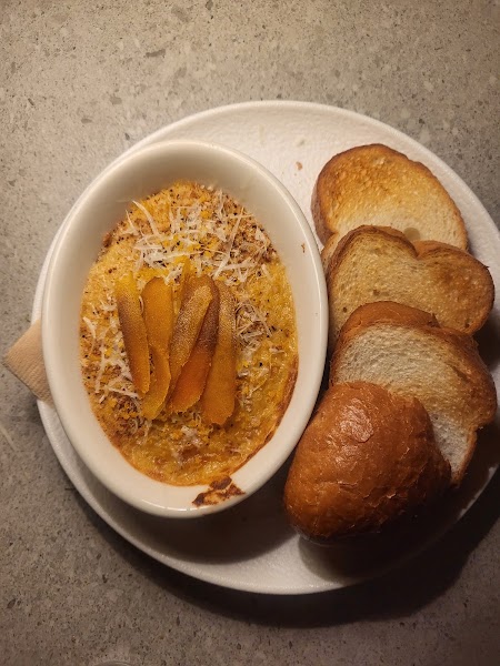 Small plate savory ramekin with cured roe served with toasted bread