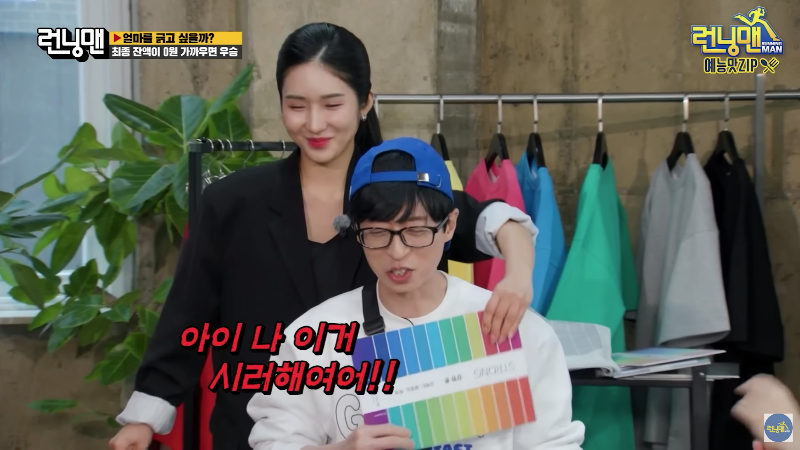 Personal color consultant assisting client with color swatch palette in studio