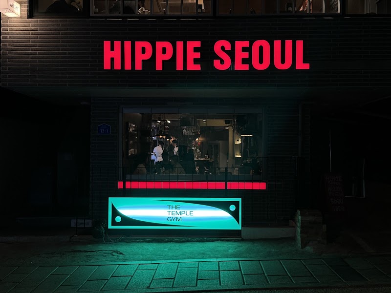 Nighttime exterior view of Hippie Seoul storefront along Sinheung-ro