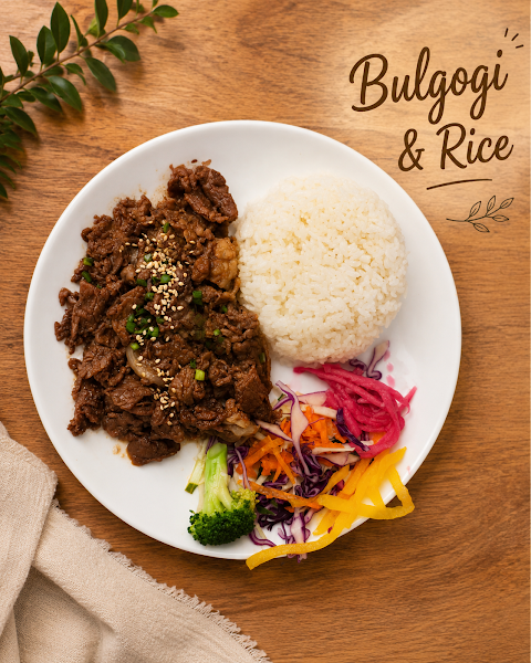 Plate of marinated Halal beef bulgogi served with steamed rice and fresh vegetables