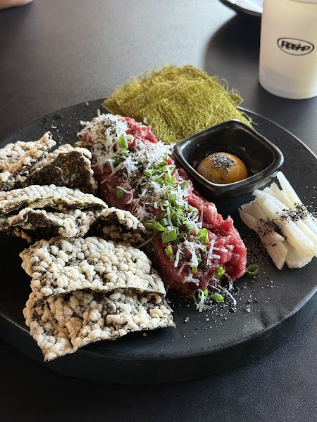 Korean beef tartare with seaweed crackers and egg yolk