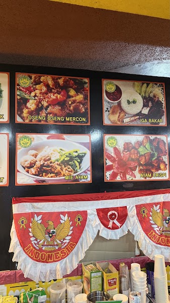 Menu board at Bakso Bejo Korea Halal Restaurant in Seoul displaying photos of Indonesian dishes with an Indonesian flag banner
