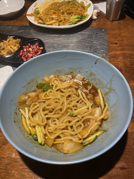 Warm bowl of corn noodle soup with rich savory broth