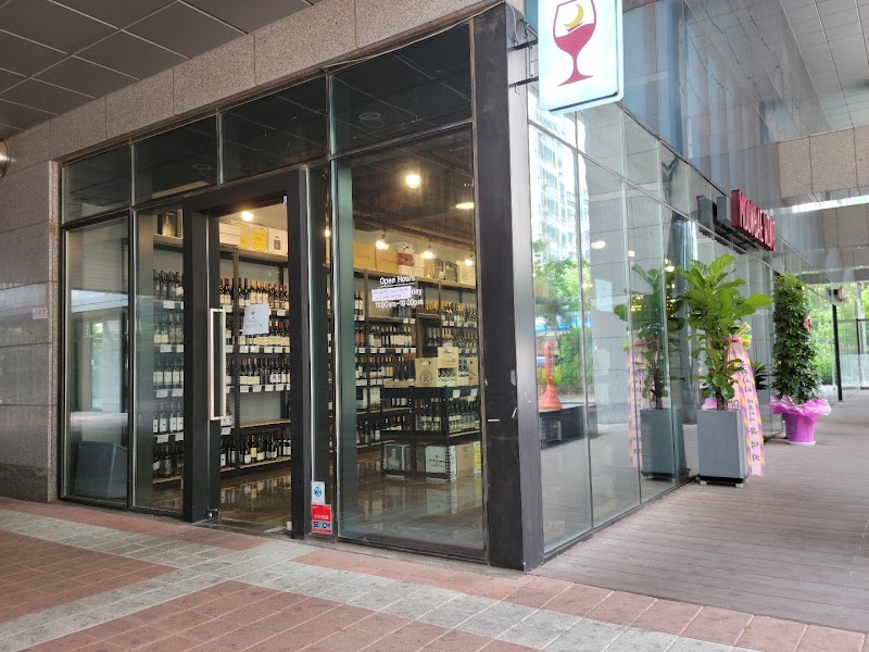 Storefront of Moonbaewine with floor-to-ceiling glass windows and visible wine shelves