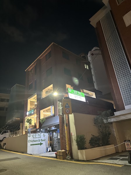 Exterior night view of Namsan Garden restaurant building in Myeong-dong Seoul
