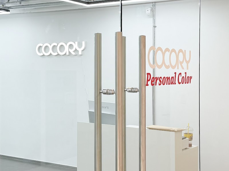 Entrance to COCORY Personal Color consultation office in Myeongdong with glass doors and minimalist decor
