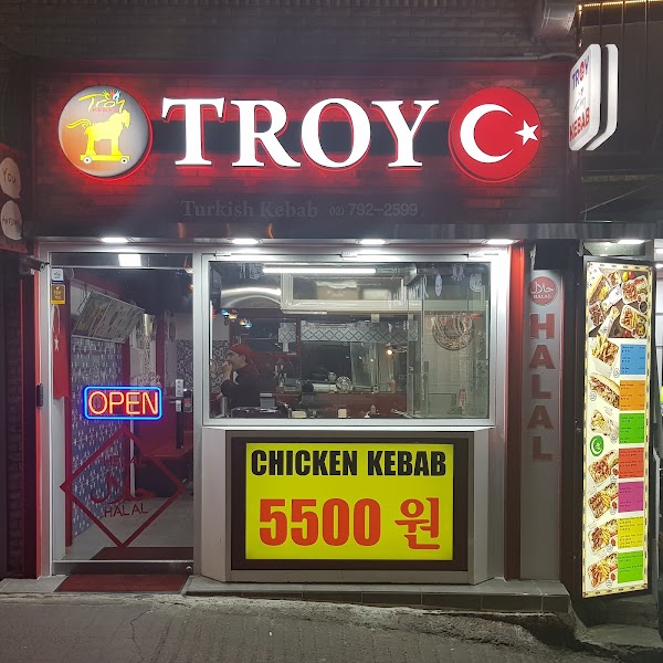 Storefront of Troy Kebab shop in Seoul with illuminated signage and exterior menu