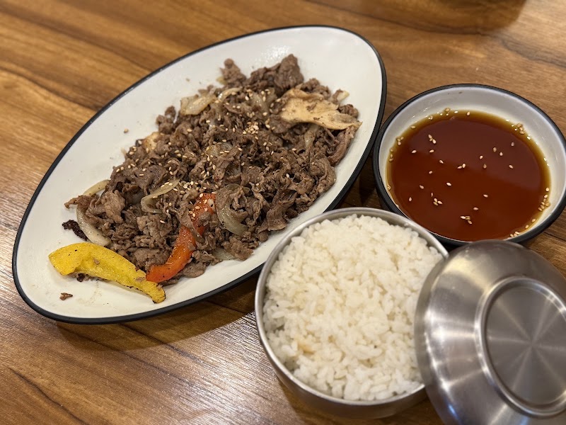 Beef Bulgogi stir-fry with onions, peppers, and rice