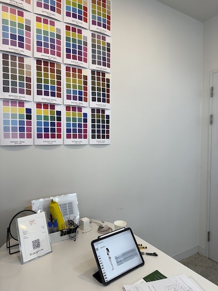 Personal color charts and tablet displayed on consultation desk