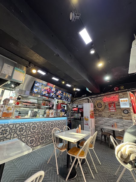 Interior of Troy Kebab shop with patterned counter and dining tables