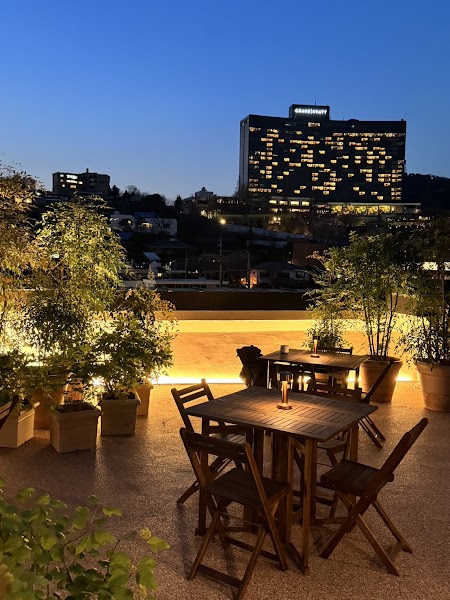 Outdoor terrace seating overlooking twilight Hannam cityscape