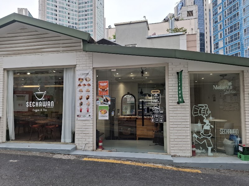 White brick storefront of Sechawan Coffee & Tea in Seoul