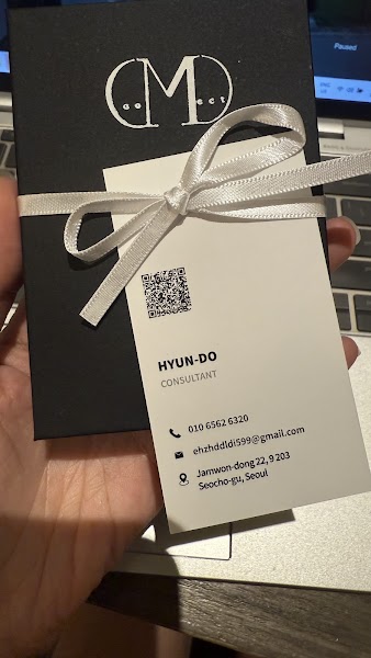 Consultation kit box with white ribbon and studio business card