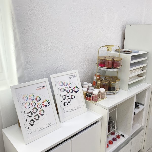 Tone charts and color pigment jars arranged in the studio