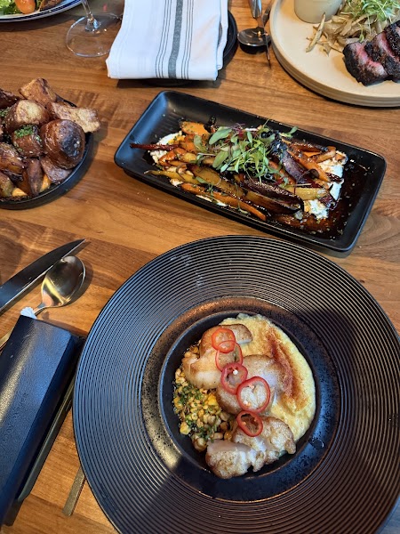 Overhead flat lay of multiple plates showcasing Latin American flavor profiles