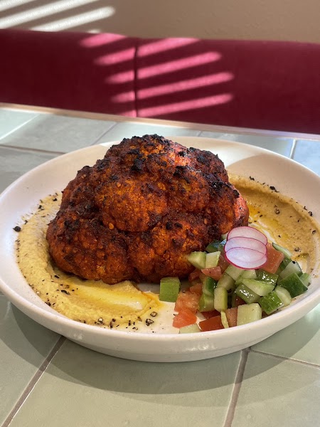 Charred roasted cauliflower with house hummus and cucumber radish relish