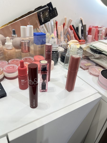 Curated cosmetic products, lipsticks, and liquid foundations on vanity