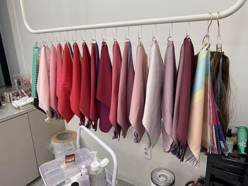 Calibrated diagnostic fabric draping swatches on studio rack
