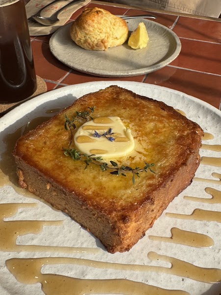 Thick-cut golden French toast with butter and maple syrup