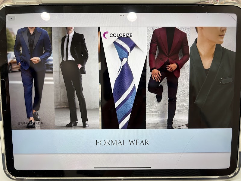 A tablet screen displaying a collage of men's formal wear images and the Colorize brand logo