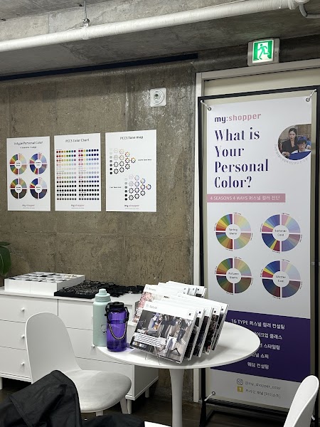 Studio area with educational color charts and consultation booklets
