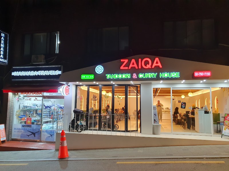 Exterior nighttime view of Zaiqa Restaurant storefront on Usadan-ro in Seoul