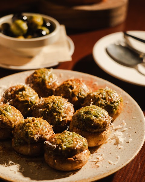 Stuffed mushrooms with fresh green herbs and grated cheese