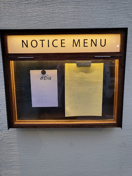 Outdoor illuminated menu notice case mounted on exterior wall