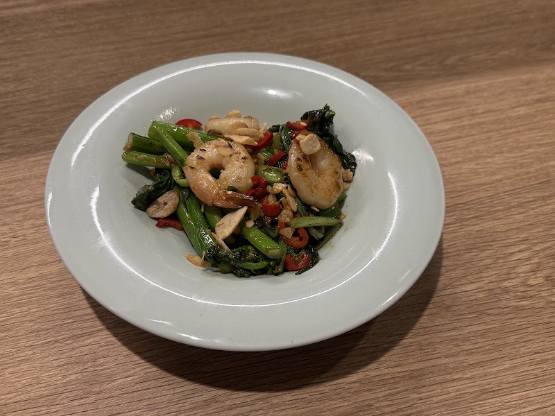 Sautéed shrimp and seasonal greens with chili and garlic