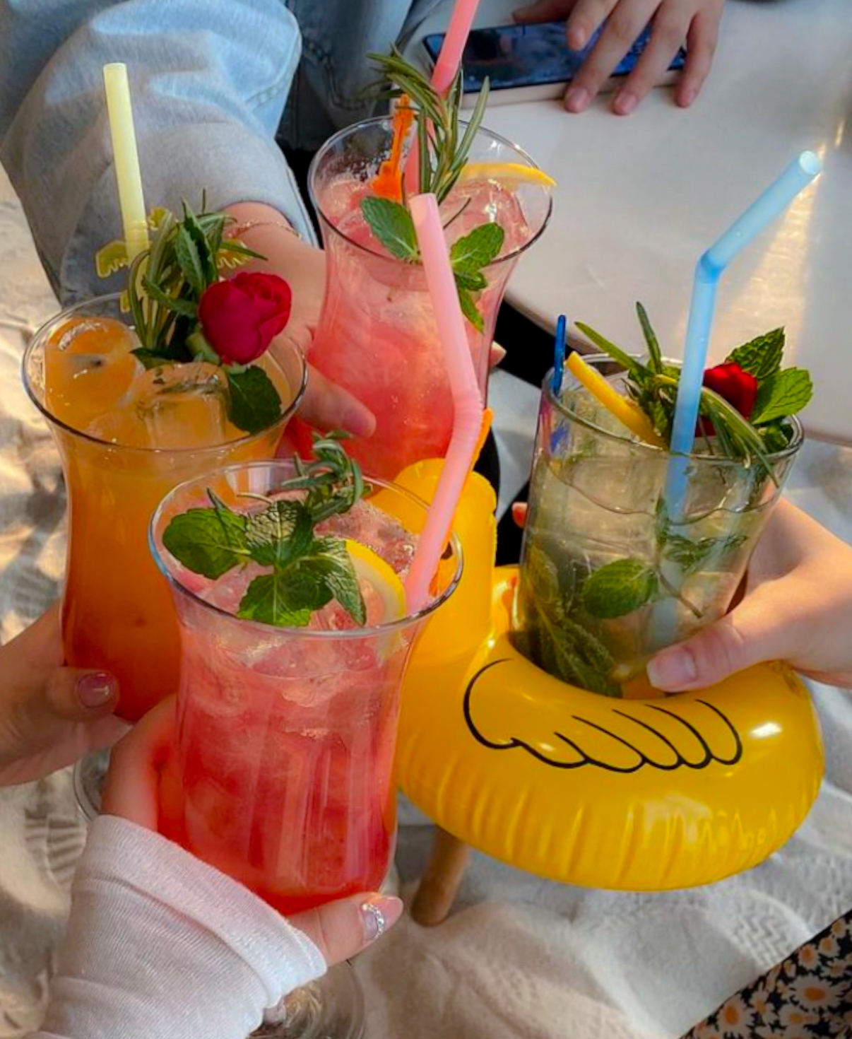 Three colorful cocktails served in tasting flight glasses