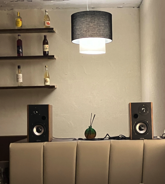 Warm ambient pendant lighting and curated bar counter inside Daejeop