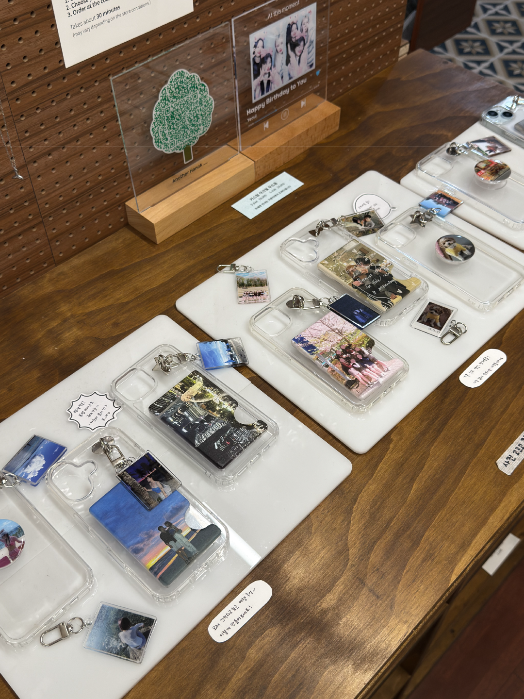 Display table with custom phone cases and photo keyrings