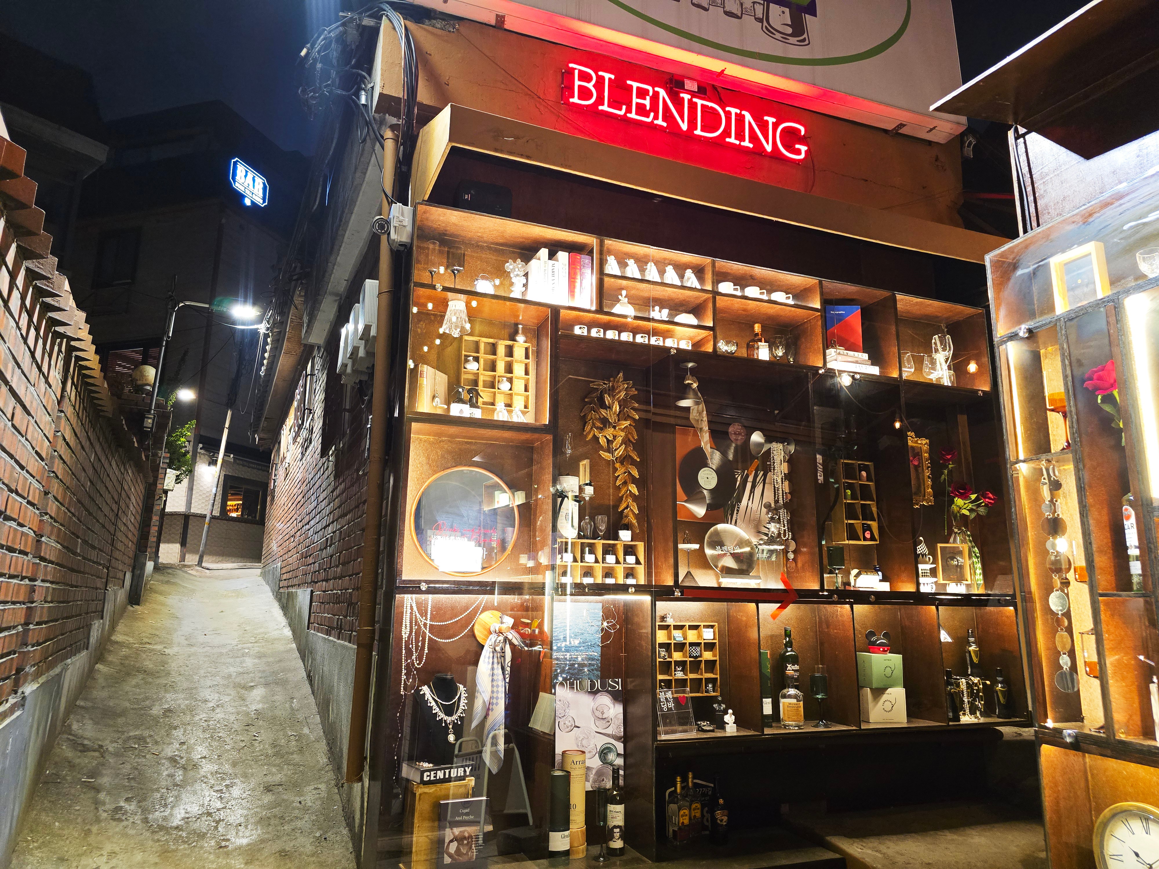 Night exterior view of Blending Bar storefront with neon sign in Itaewon