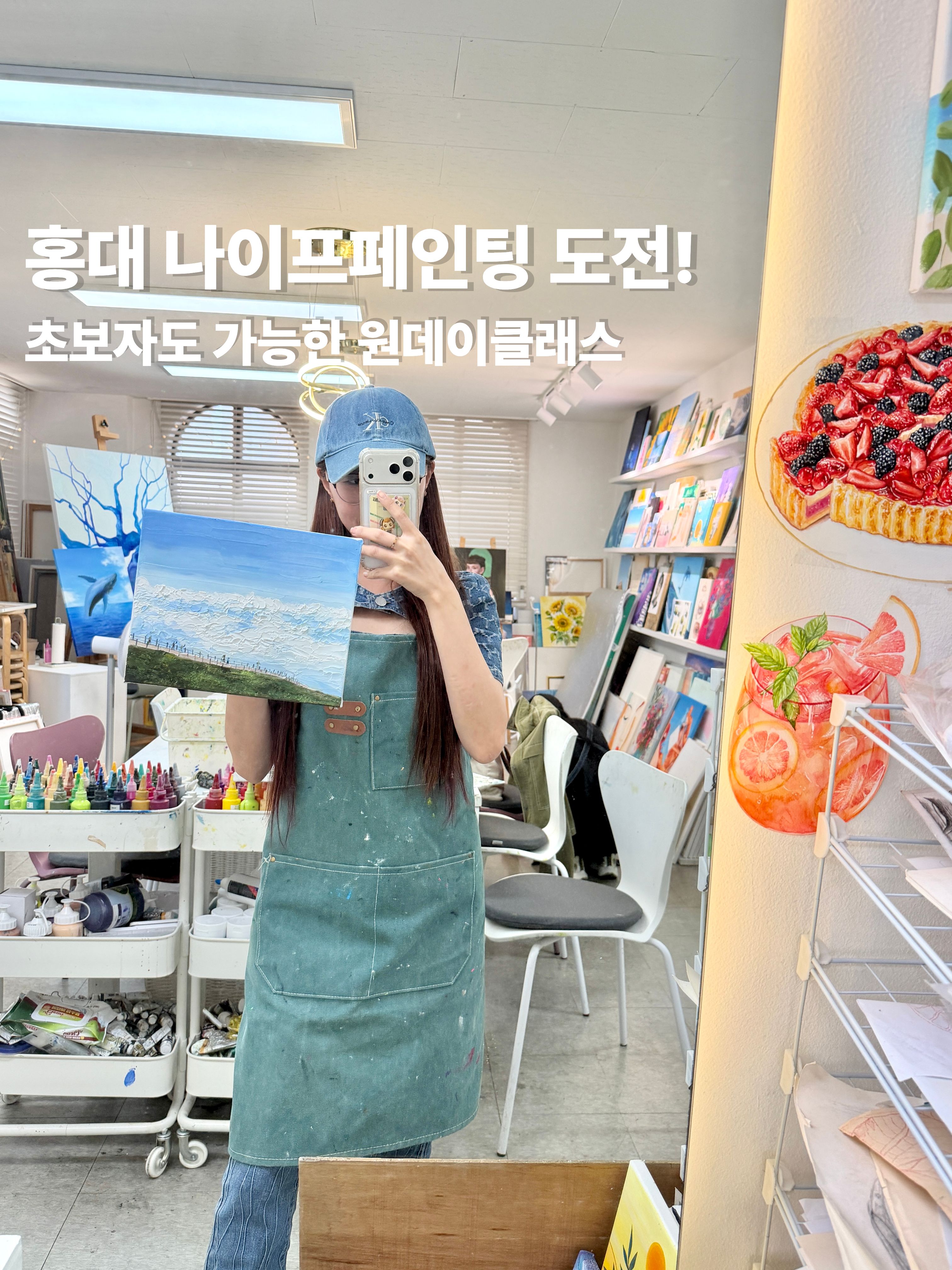 Student holding palette knife painting