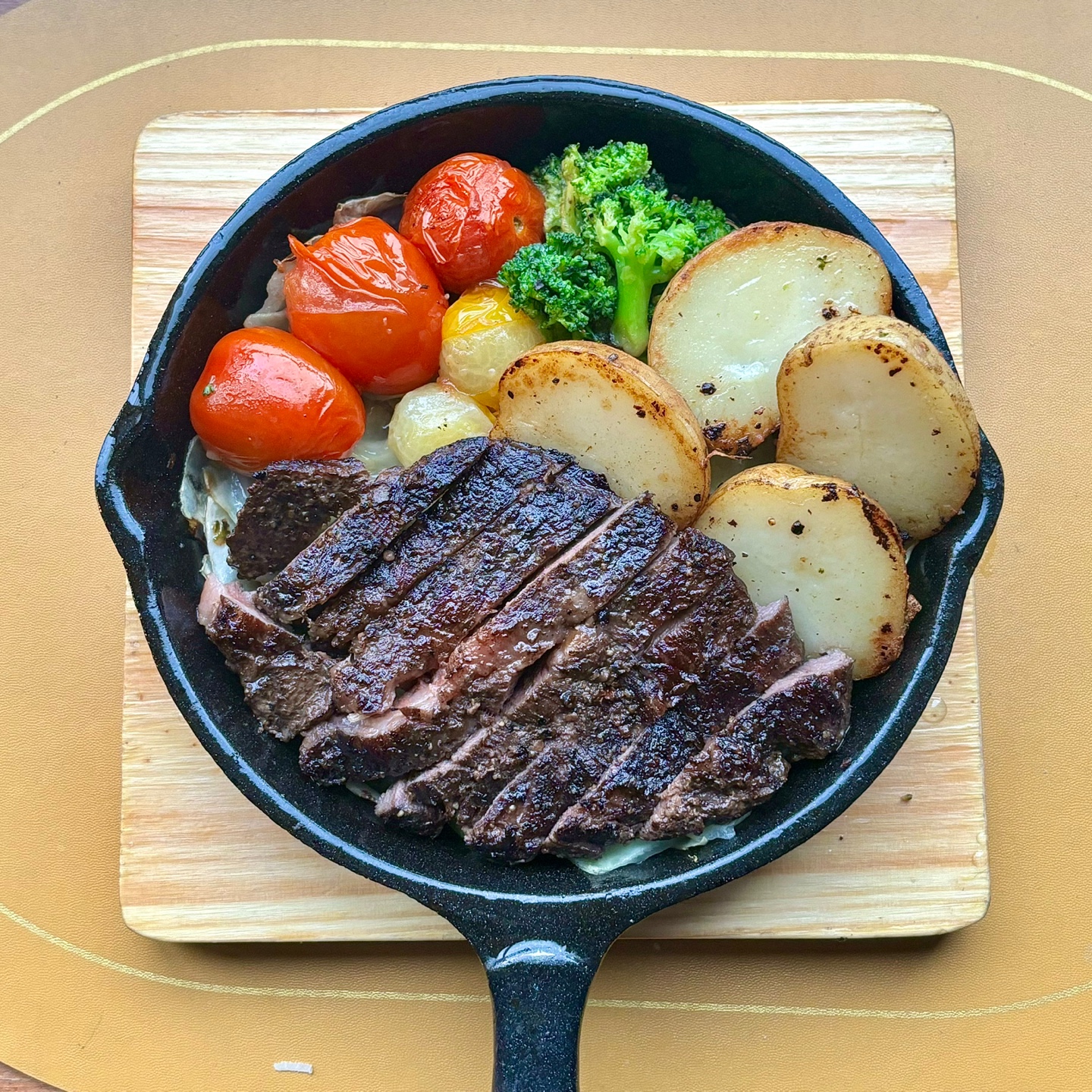 Tender sous-vide steak served in cast iron skillet