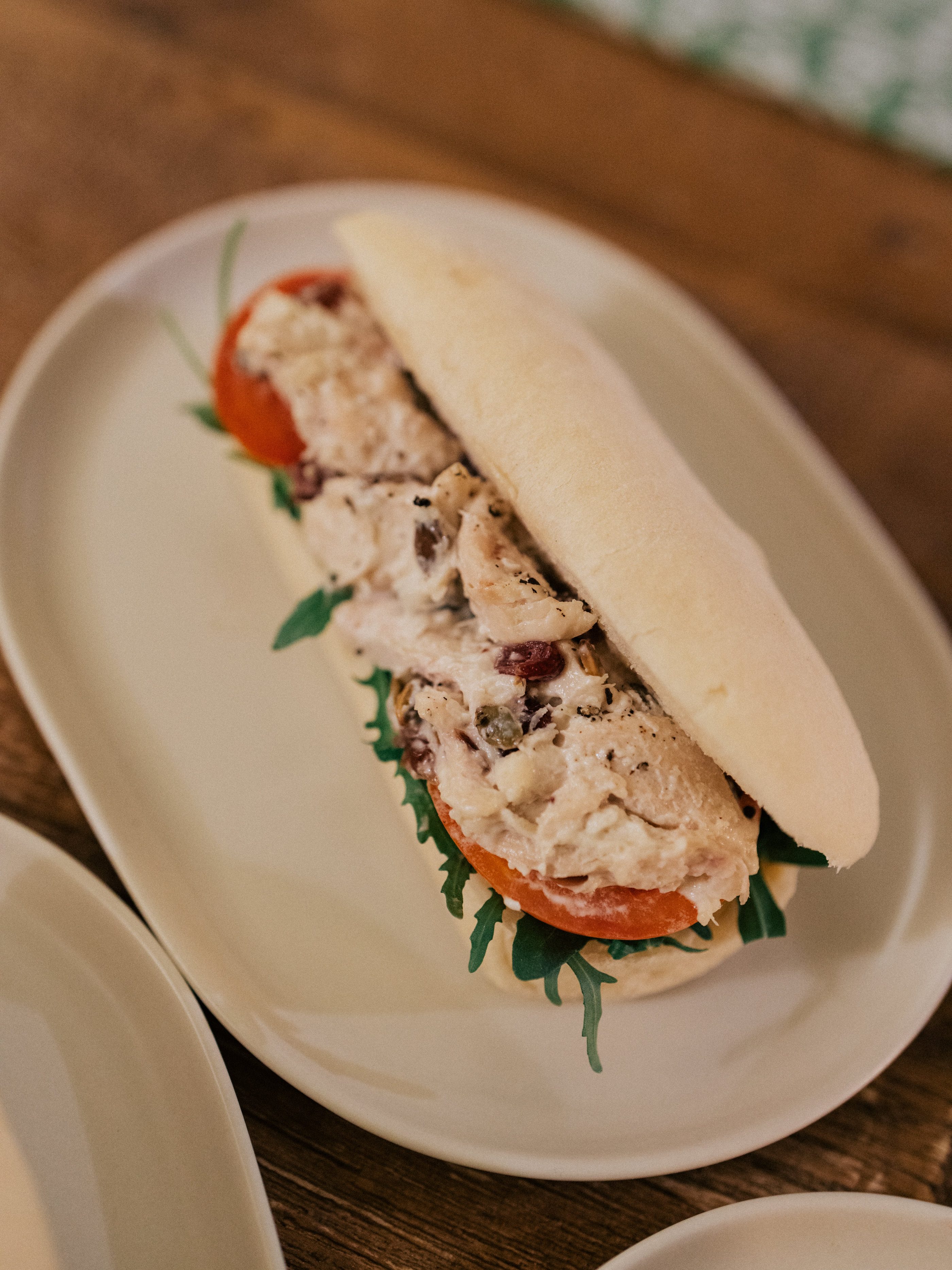 Chicken salad sandwich with tomatoes and greens
