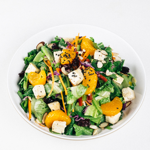 Tofu salad bowl with mandarin oranges, almonds, and greens